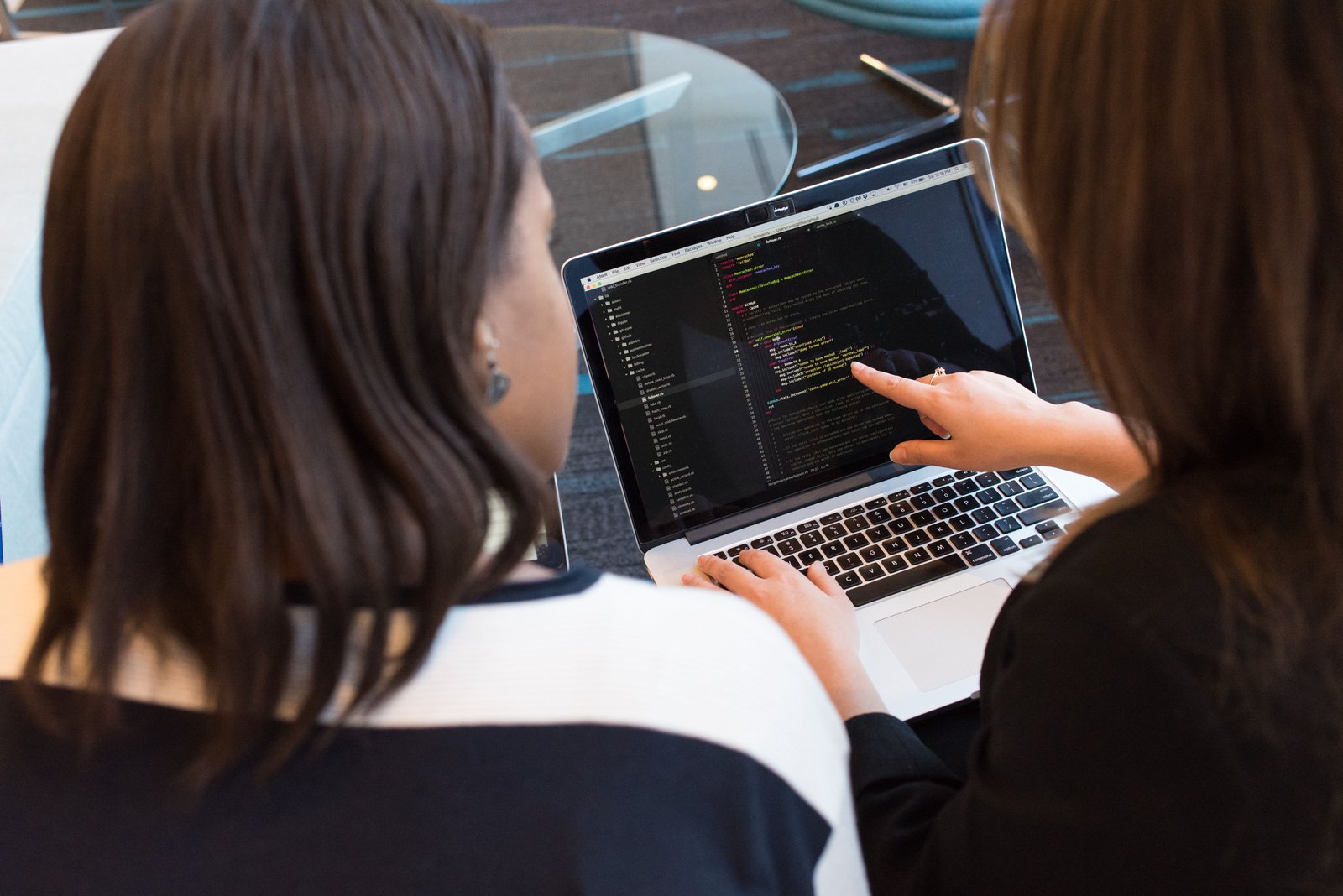 Technology professionals collaborating on a laptop